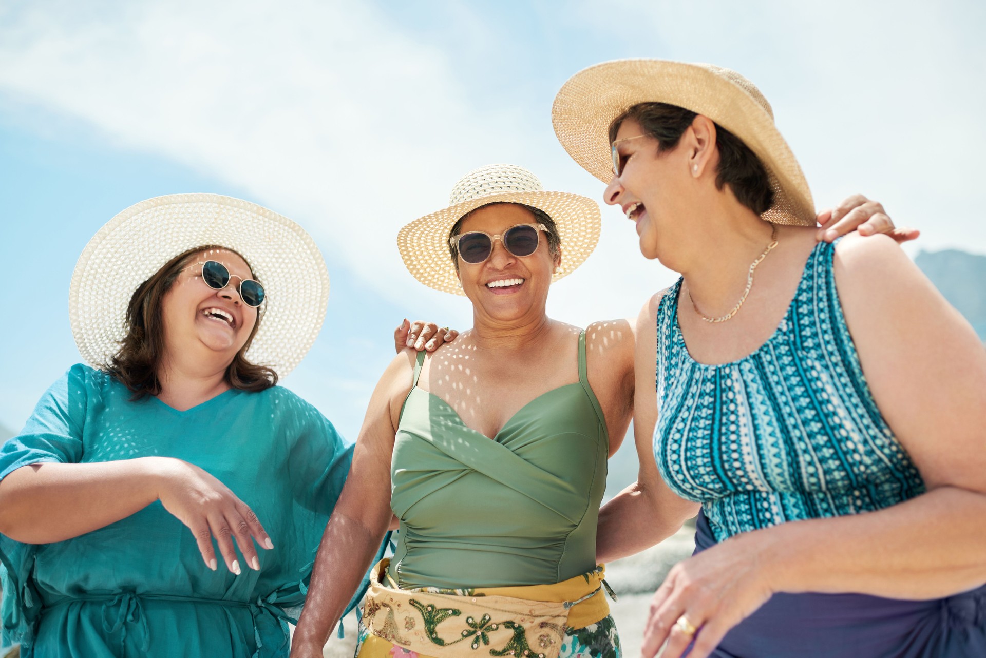 Shot of a mature group of friends standing together during a day out on the beach