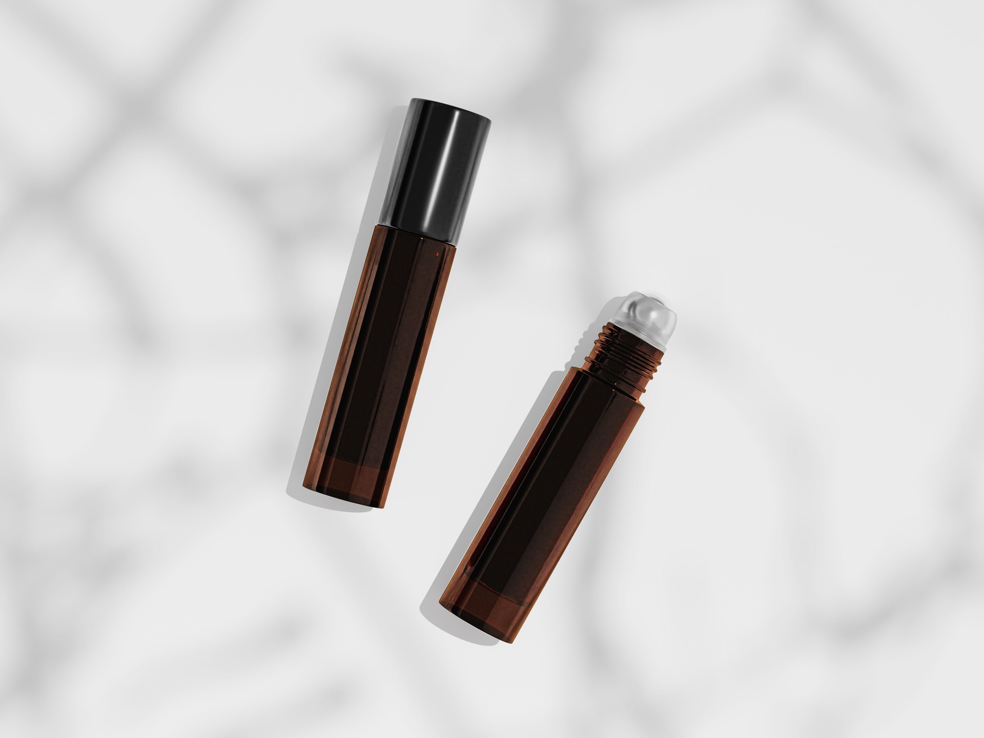 10 ml amber glass roller bottles mockup, brown glass roll-on bottle lay flat on clean background, organic concept image of aroma oil and liquid cologne packaging, cylindrical shape perfume container